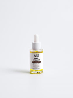 Bottle of Wild Earth natural alternative face serum on a white background