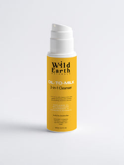 Yellow bottle of Wild Earth Naturals Oil-to-Milk 2-in-1 Cleanser on a light gray background