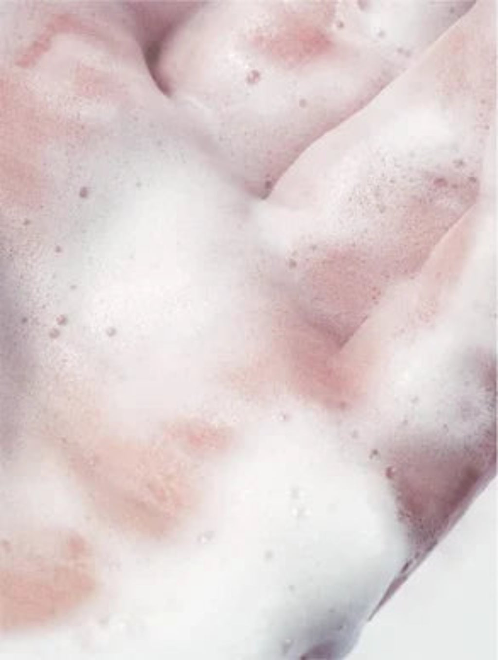 Close-up of pink fabric with white foam texture