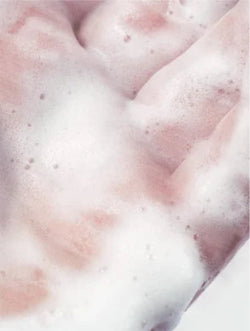 Close-up of pink fabric with white foam texture