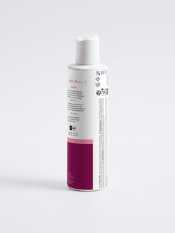 Wild Earth Naturals Rose Water Hydrating Facial Toner on a White bottle with a pink base on a white background