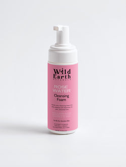 Wild Earth Rose Water Cleansing Foam bottle on a light gray background
